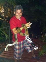 Capt. Richard Barone with Boa constrictor caught on Gaia Resort and Spa